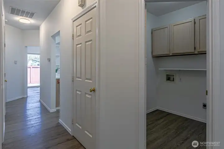Laundry room with storage.