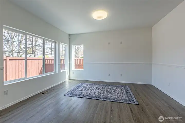 Family room area with windows for all the natural light coming into the space.