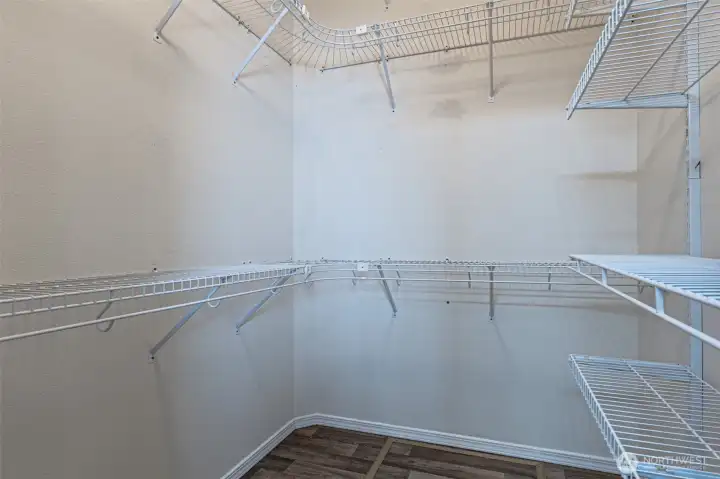 Master walk in closet with extended hanging space.