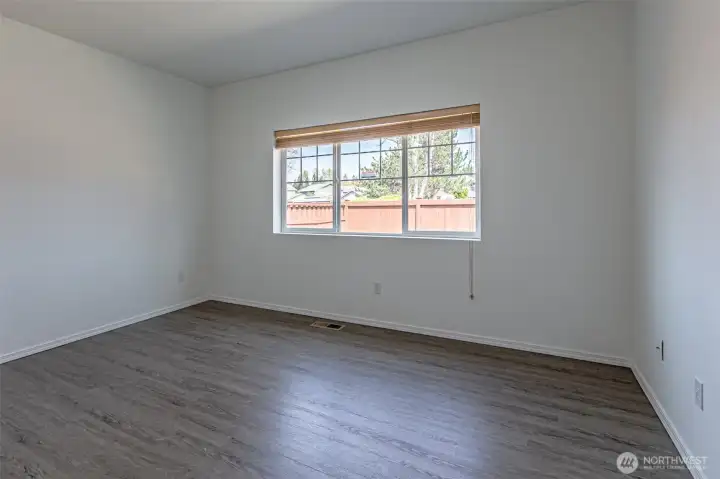 Spacious master with lots of natural light located at the back of the house.