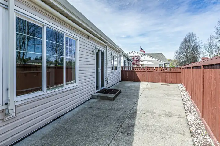 Easy care back yard ready to your personal touches.  Notice the awning that makes a nice cover from the elelments.