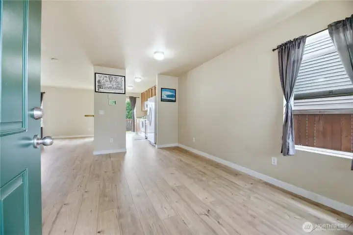 Step inside to the open concept kitchen and dining area with NEW Luxury Vinyl Plank Flooring Step inside to the open concept kitchen and dining area with NEW Luxury Vinyl Plank Flooring
