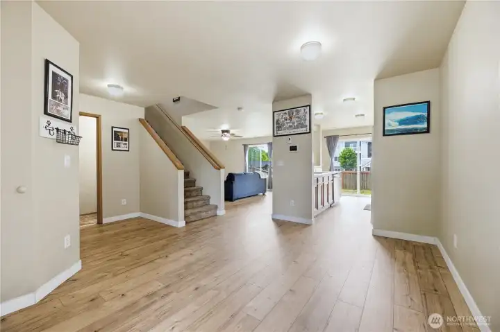 The main floor has new, luxury vinyl plank, this area could be a large dining area The main floor has new, luxury vinyl plank, this area could be a large dining area
