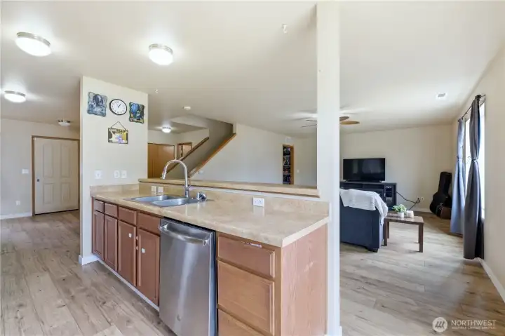 Kitchen looks out to spacious living room Kitchen looks out to spacious living room