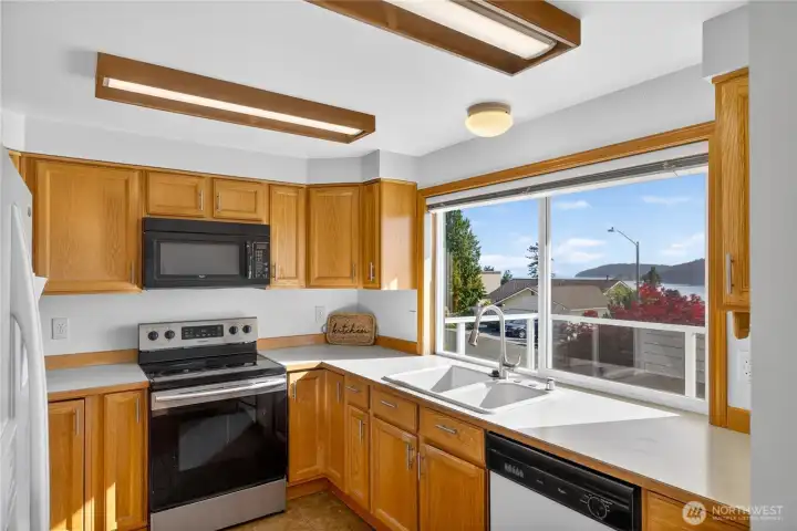 Large kitchen window is perfect to soak up the sun Large kitchen window is perfect to soak up the sun
