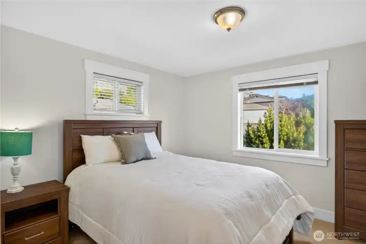 Guest bedroom on the main level of the home. Guest bedroom on the main level of the home.
