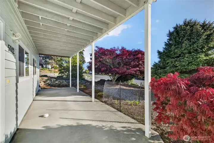 Covered patio area under the deck. Covered patio area under the deck.