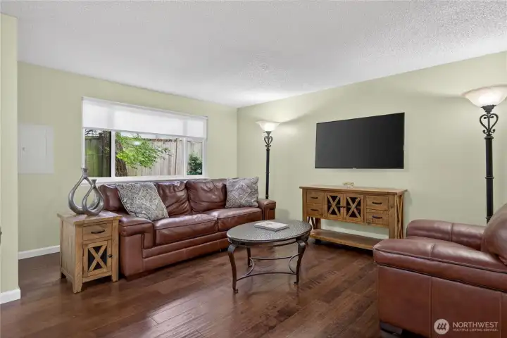 Living area with a huge window. Living area with a huge window.