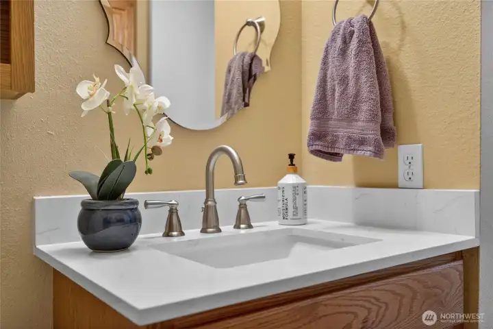 Main floor half bath with a beautiful counter top! Main floor half bath with a beautiful counter top!