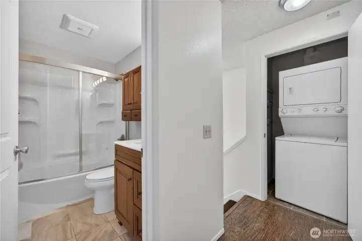 Upstairs full bath and view of washer and dryer closet. Upstairs full bath and view of washer and dryer closet.