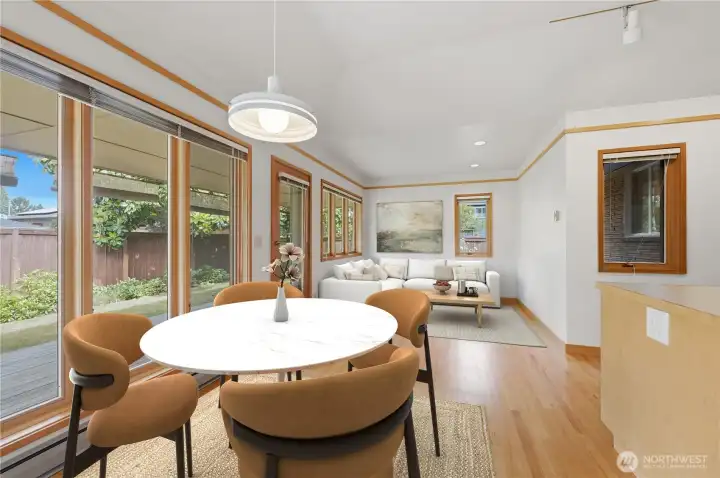 Virtually staged Breakfast area with an adjoining family room.