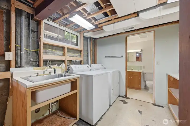 Utility room with three quarter bathroom.