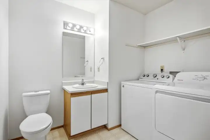 1/2 Bath main floor with laundry. 1/2 Bath main floor with laundry.