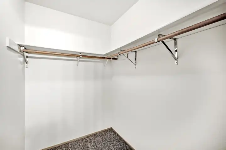 Primary walk in closet. Primary walk in closet.