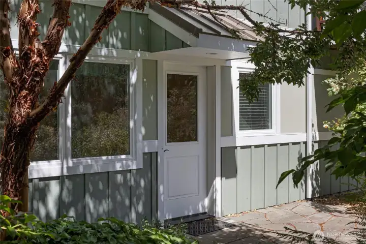 Tucked among vibrant ferns, vine maples, and western red cedars, a charming accessory structure with a glass-panel door offers versatile flex space ideal for a studio, workshop, craft room. The beautifully integrated outbuilding enhances the property's functionality while honoring the lush Pacific Northwest landscape. Tucked among vibrant ferns, vine maples, and western red cedars, a charming accessory structure with a glass-panel door offers versatile flex space ideal for a studio, workshop, craft room. The beautifully integrated outbuilding enhances the property's functionality while honoring the lush Pacific Northwest landscape.