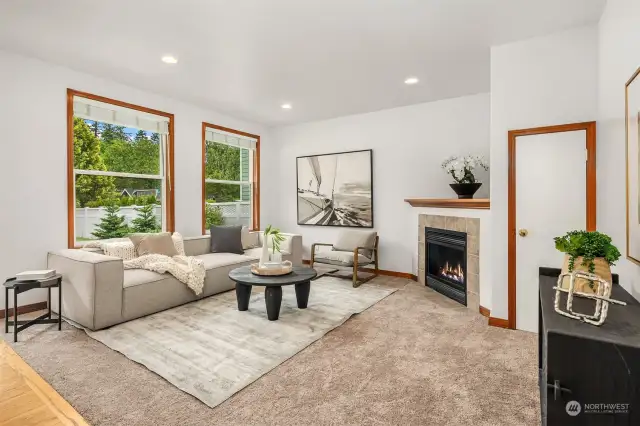 The family room off the kitchen features a gas fireplace.