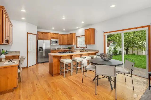 The kitchen offers a spacious breakfast nook area and opens up to the adjacent family room. With sliding glass doors opening up to the backyard, easily keep an eye on little ones playing while cooking dinner!