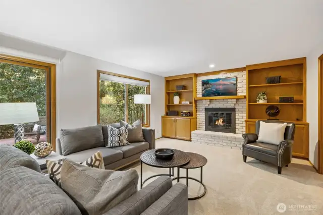 Family room off the kitchen with built-in cabinetry.