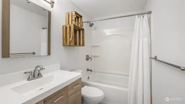 Beautifully updated main floor bathroom featuring modern finishes and stylish design for a fresh, elegant look.