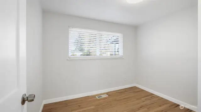 Primary Bedroom with large window.