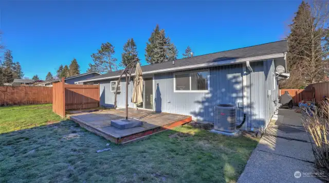 Outside, enjoy a fully fenced backyard with private patio.