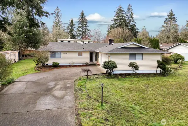 Classic, hard-to-find 4-bedroom rambler on a spacious .27-acre fully fenced lot in a desirable, established neighborhood with no HOA! This pristine, move-in ready home features a newer roof, fresh interior paint, new carpet, new blinds, updated insulation, and wide-plank laminate hardwoods in the entry, living, and hallway. The open and sprawling floorplan is ideal for entertaining or daily living. Enjoy energy-efficient comfort with vinyl windows and a heat pump with A/C. Both bathrooms have been updated with new vanities, flooring, mirrors, and faucets. Relax in the cozy sunroom or by one of two fireplaces. 2-car garage, extra parking, a garden shed, and plenty of yard space for gardening or play. Welcome home!