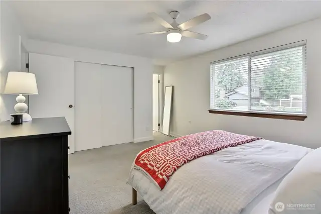 Enjoy generous closet space and great natural light in this well-appointed primary suite. The neutral color palette, updated finishes, and private bath access make this room both functional and inviting.