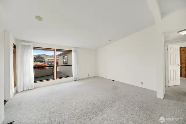 Living room with large picture windows.