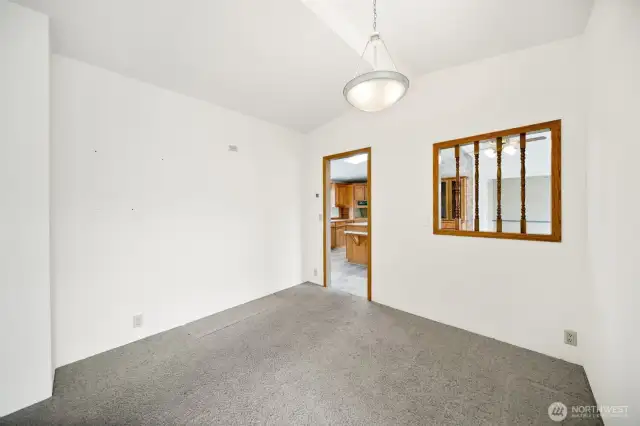 Dining area looking into kitchen.