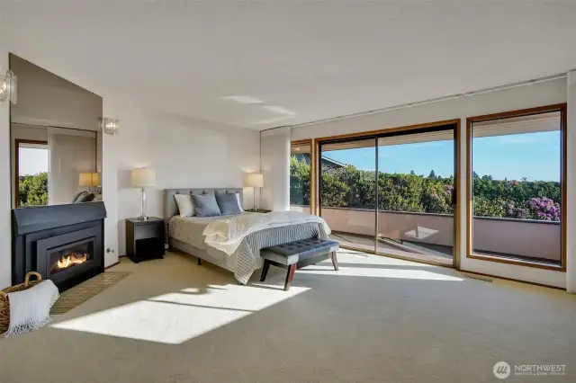 Generous primary suite boasts of fireplace, and slider door to balcony making this your own personal retreat.