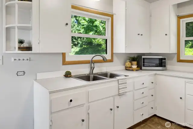 Complete with a large window above the kitchen sink for enjoying the view while washing dishes