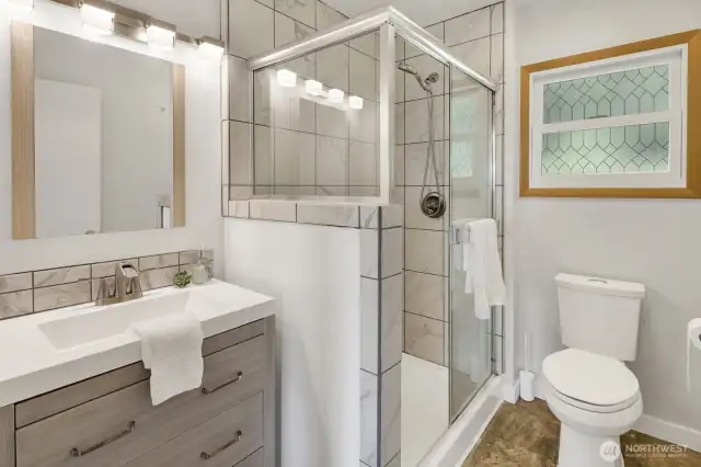 Main level 3/4 bathroom is bright and spacious