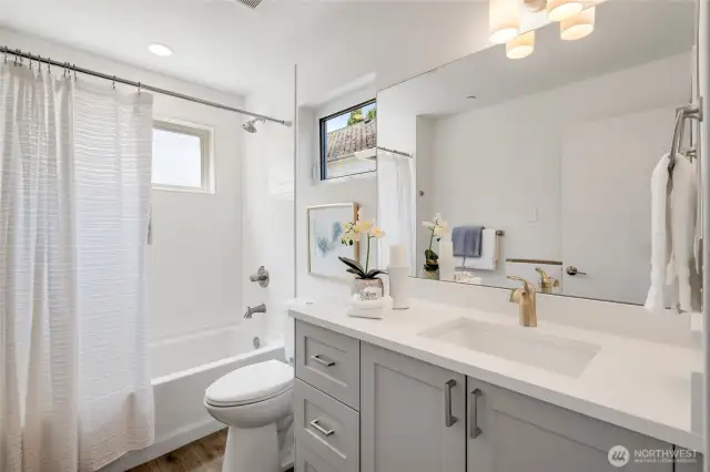 Tile surround and quartz countertops