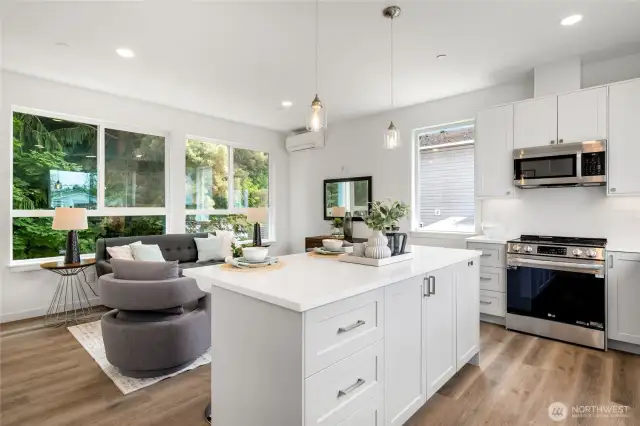 Oversized kitchen island provides plenty of counter space and seating for friends