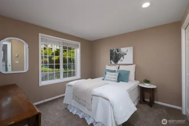PRIMARY BEDROOM WITH LOTS OF NATURAL LIGHT FROM OVERSIZED WINDOW
