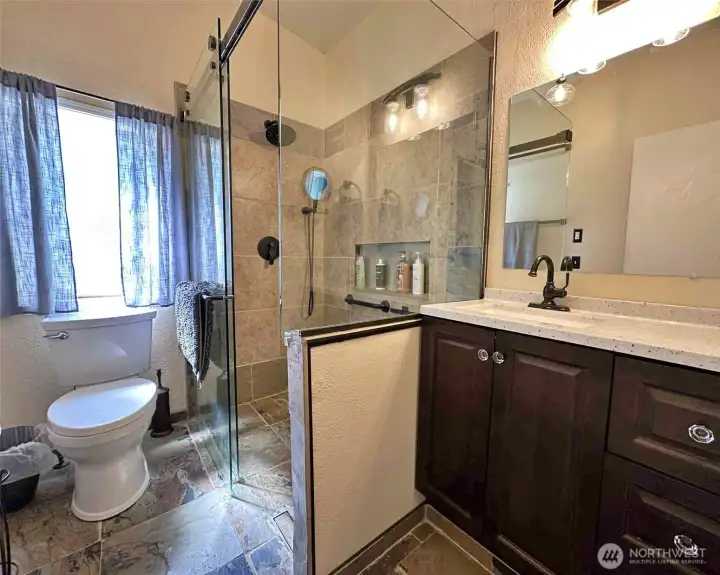 Main bathroom with heated floors walk in shower.