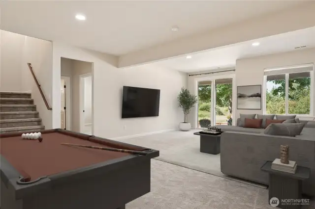 Bright and versatile lower-level bonus room with easy outdoor access via sliding doors.  This room has been virtually staged.