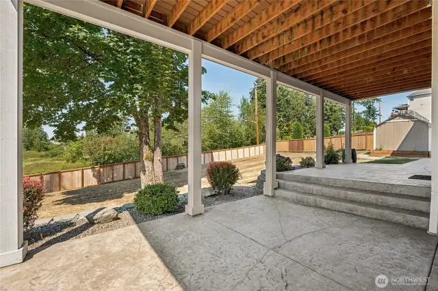 Inviting lower patio that connects the home’s lower level to the expansive backyard.