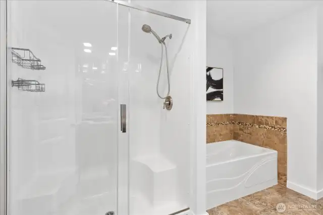 Soaking tub and separate shower in primary bathroom