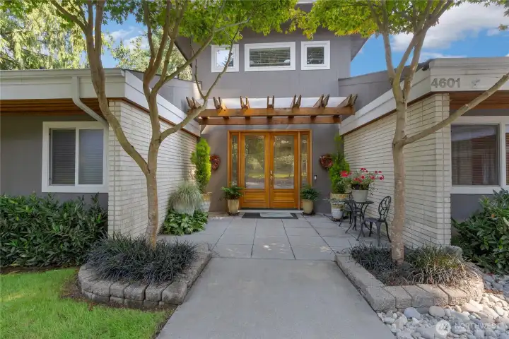 Beautiful front entry with leaded glass french doors.