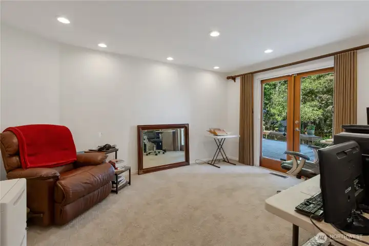 spacious den/office or could be 4th bedroom w/french doors to deck with view.