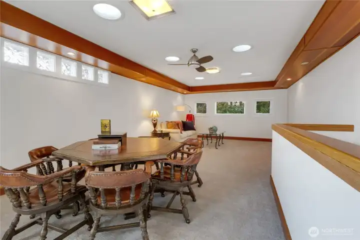 Expansive upstairs bonus room w/gorgeous woodwork  & french doors to balcony w/amazing view.
