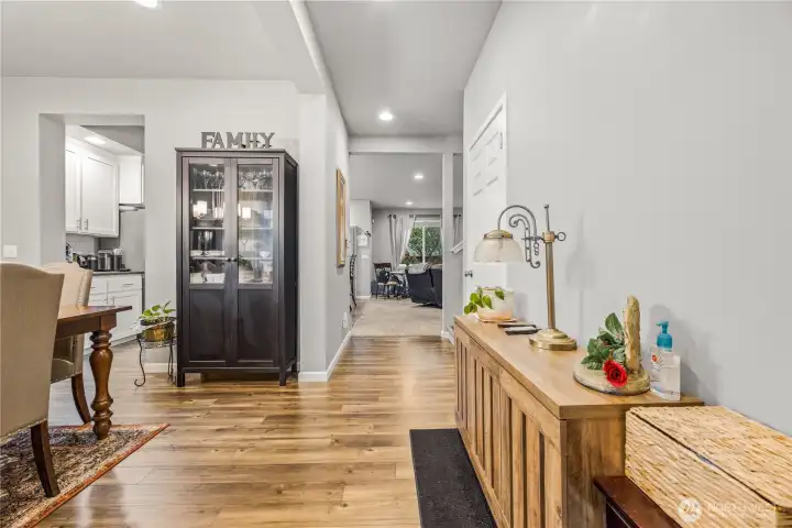 Bright, inviting entry opens into a thoughtfully designed floor plan featuring luxury vinyl plank floors, neutral tones, and seamless flow into the main living spaces.
