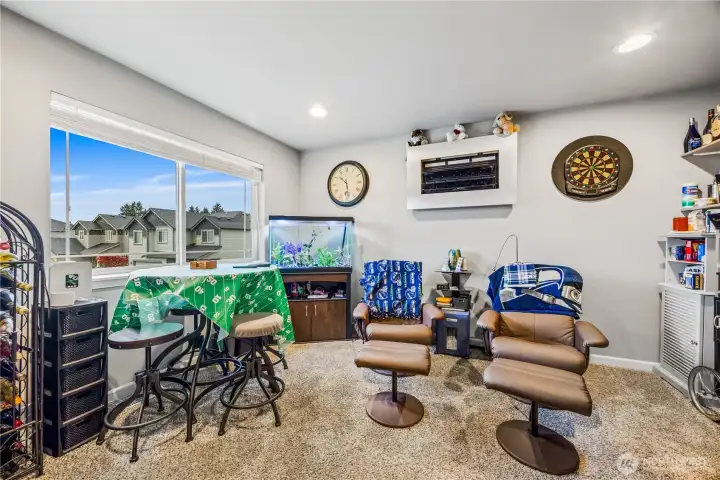 Upstairs Bonus Room / Flex Space currently used as a media space (man cave). Ideal for a home office, lounge, or playroom.