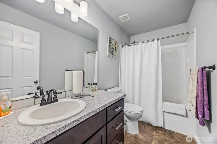 Upstairs modern full bath (between flex room and bedroom 5)