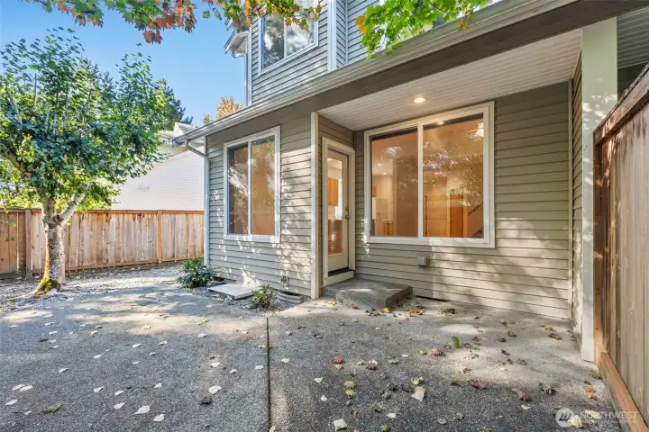 Large Backyard patio with plenty of afternoon shade, perfect for grilling in summer, unwinding after work and just enjoying the peaceful sounds of surrounding nature.