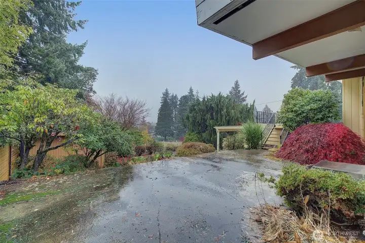 View from the patio, the stairs lead up to a deck.