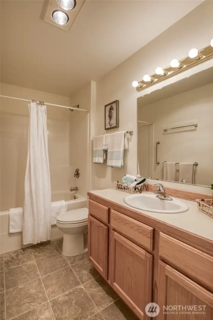 Main floor full bathroom. Located in same hall as 2 main floor bedrooms