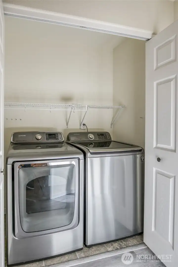 Main floor utility closet with newer washer and dryer that stays!