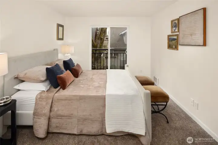 Generously sized primary retreat with western light in the afternoons and ample room to comfortably accommodate a king-sized bed.